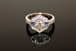 An 18ct white gold sapphire and diamond ring, the central brilliant-cut diamond weighing 0.