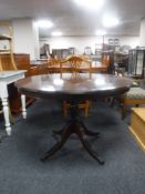 A Regency style inlaid mahogany pedestal dining table