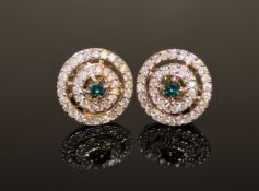 A pair of 14ct yellow and white gold diamond stud earrings,