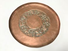 An Arts & Crafts copper charger
