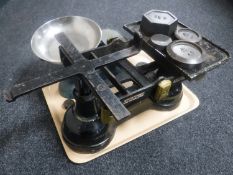 A large set of iron and brass post office scales with weights together with a set of kitchen scales