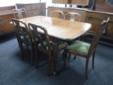 A mahogany Queen Anne style extending dining table with leaf,