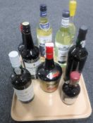 A tray containing nine bottles of assorted spirits including Tia Maria, port, drambuie,