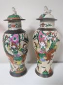 A pair of Japanese earthenware crackle glaze lidded vases depicting samurai,