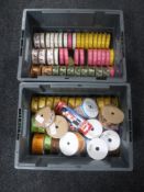Two boxes containing spools of ribbon
