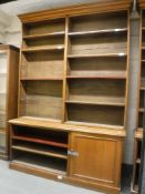 A Victorian oak bookcase fitted with a panelled cupboard below, width 201 cm,