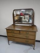 A Victorian inlaid mahogany dressing chest fitted four drawers