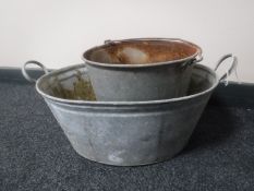 A galvanised wash tub together with similar bucket