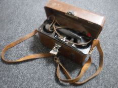 A vintage Bakelite post office engineer's telephone in case together with a vintage leather tool