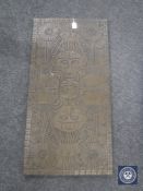 A carved Inka style wall panel