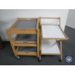 A pine three tier kitchen trolley with tray and one other trolley