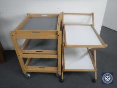 A pine three tier kitchen trolley with tray and one other trolley
