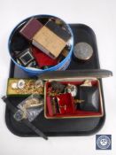 A tray of costume jewellery, bullet sell casing, key rings, gents watch,