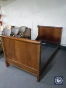An antique mahogany 3'6 bed frame