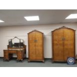 An early 20th century walnut three piece bedroom suite with 4'6 bed ends