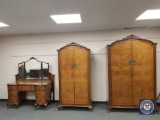 An early 20th century walnut three piece bedroom suite with 4'6 bed ends