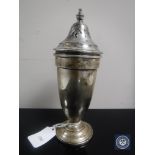 A silver sugar sifter,