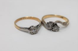 An 18ct gold diamond solitaire ring and an 18ct gold diamond crossover ring