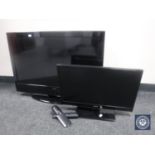 A Technika 32" LCD TV with remote and a Polaroid 22 inch LCD TV with remote