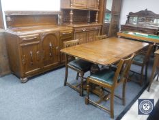 A six piece carved oak Lees style dining room suite
