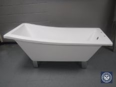 A contemporary shaped bath on chrome metal feet