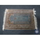 A Kayseri prayer rug, Anatolia, on turquoise ground with cream borders,