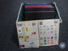 A basket of five albums of 20th century stamps of the world