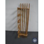 A pine hat and coat rack with shelf