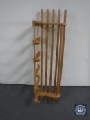 A pine hat and coat rack with shelf