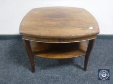 A rosewood two tier occasional table