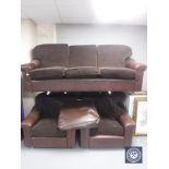 A late 20th century brown leather and cloth three piece lounge suite