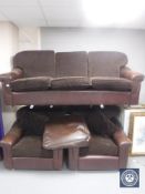 A late 20th century brown leather and cloth three piece lounge suite