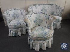 An antique three piece shaped back suite