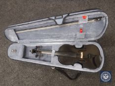 A Stentor Harlequin violin and bow in a fitted case