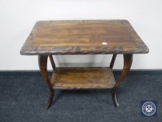 An early 20th century pine two tier occasional table