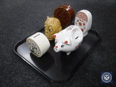 A tray of five pottery money boxes including a Carlton Ware clown