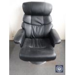 A black leather swivel adjustable armchair on chrome base