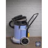 A Numastic industrial wet and dry vac cleaner,