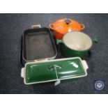 A tray of two Le Cruset oven dishes one with lid,