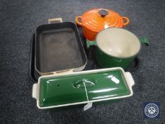 A tray of two Le Cruset oven dishes one with lid,