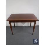 An antique inlaid mahogany table