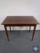 An antique inlaid mahogany table