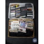 A box of 7" singles - The Beatles, The Jam, The Cure,