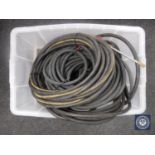 A box of pressure washer hoses
