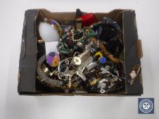 A box of costume jewellery, rolled gold wrist watch, foreign coins,