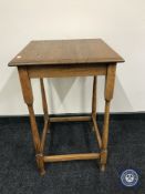 A square Edwardian oak occasional table