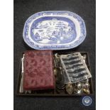 An antique blue and white meat plate, wooden cutlery tray and cutlery,