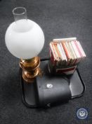 A tray of Duplex copper oil lamp with glass chimney and shade, set of cased binoculars,