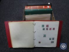 A box of four albums and a quantity of sheets containing 20th century stamps of the world