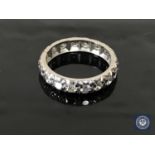 A diamond full eternity ring in white metal, approximately 1ct.